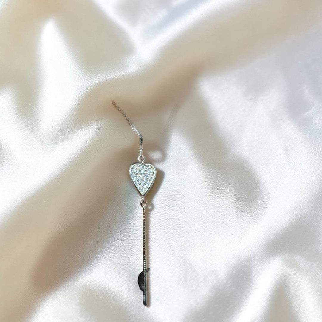 BlingbyAnvika 925 sterling silver bracelet with adjustable slider clasp and a heart charm encrusted with cubic zirconia.