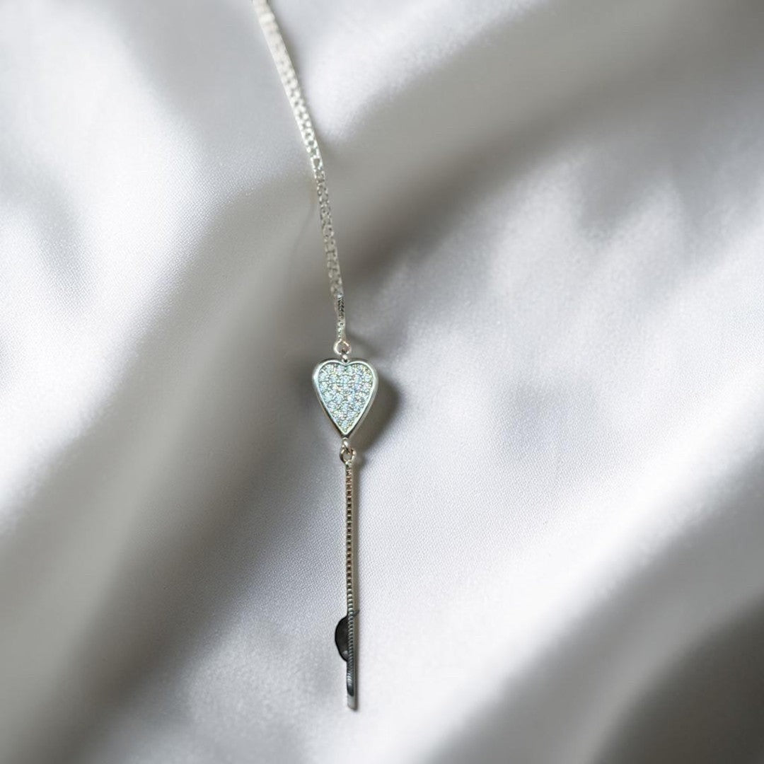 BlingbyAnvika 925 Sterling Silver bracelet with a heart charm paved with cubic zirconia. Adjustable slider clasp.