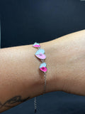 BlingbyAnvika 925 sterling silver bracelet with pink and white enamel heart charms, a sweet accessory for her.