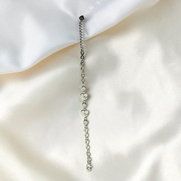 BlingbyAnvika 925 Sterling Silver bracelet with cubic zirconia heart charms and infinity links.