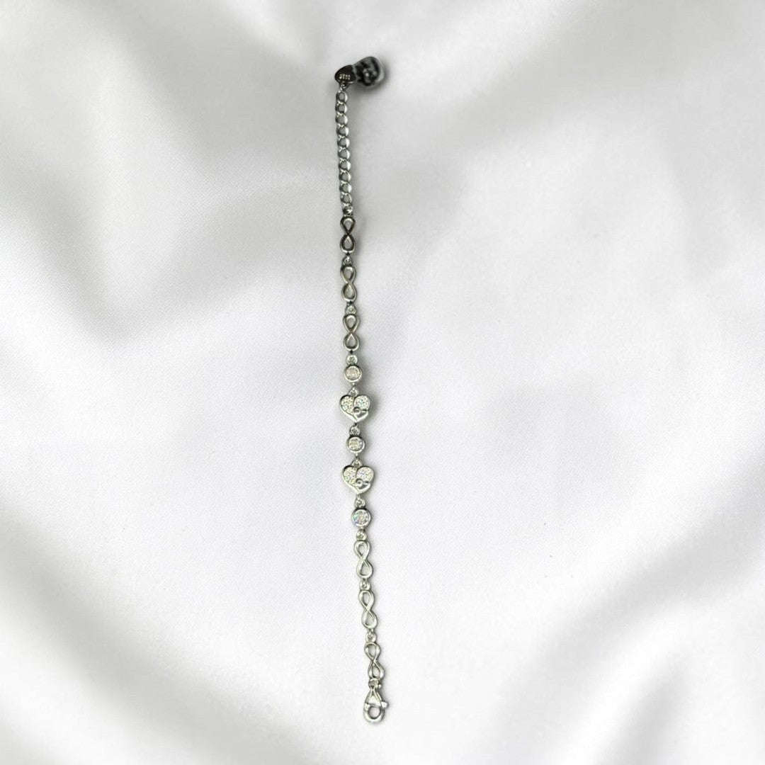 BlingbyAnvika 925 sterling silver bracelet with cubic zirconia heart charms and infinity links.