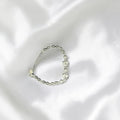 BlingbyAnvika 925 Sterling Silver bracelet with cubic zirconia heart charms and infinity links.