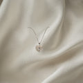 BlingbyAnvika 925 sterling silver split heart necklace with cubic zirconia stones on a delicate chain.