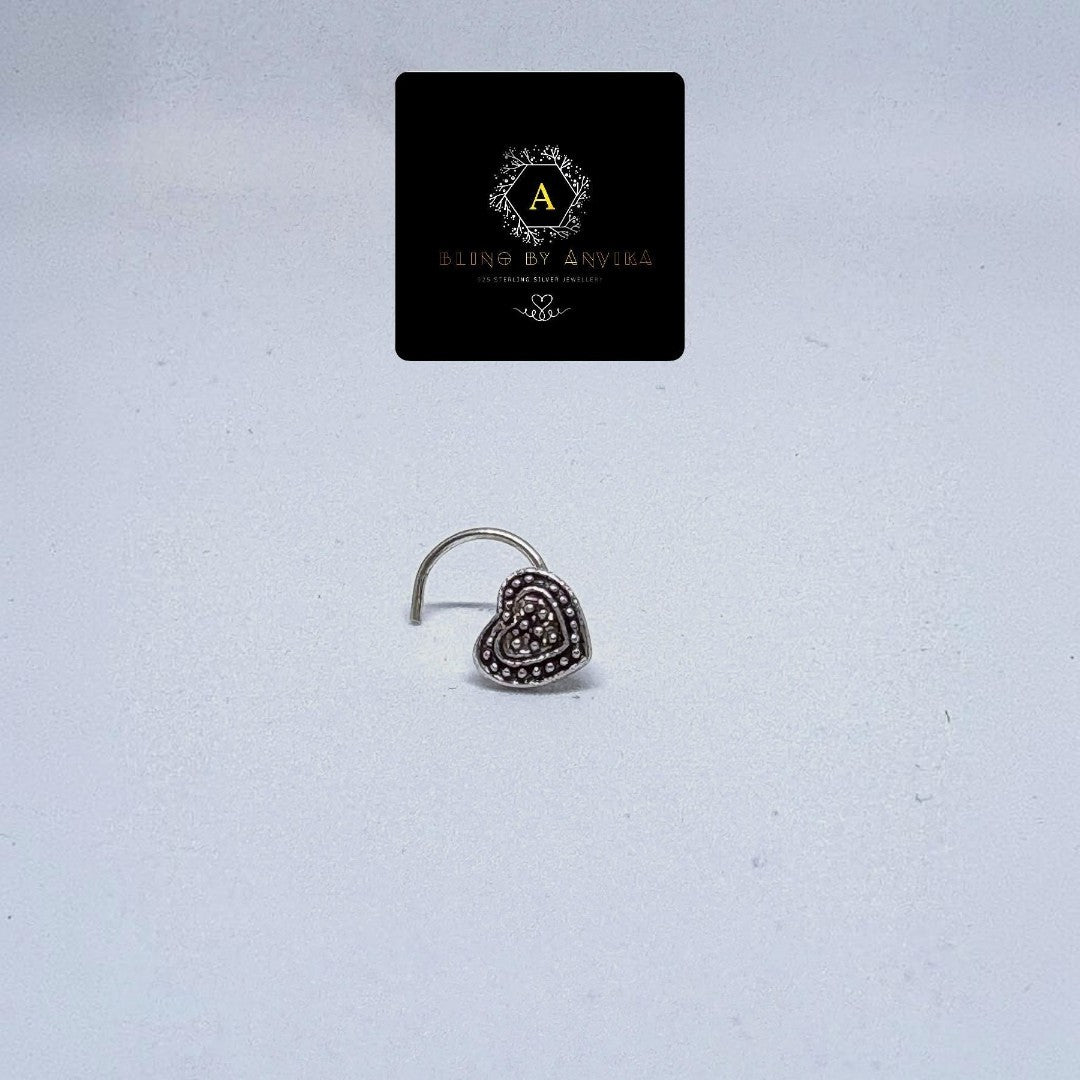 BlingbyAnvika 925 sterling silver nose pin featuring a delicate heart shape with intricate beaded detailing.