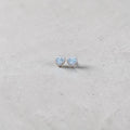 BlingbyAnvika sterling silver heart stud earrings featuring sparkling AAA-grade zircon stones on a grey background.