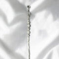 BlingbyAnvika 925 silver infinity link chain bracelet with sparkling accents on a white satin background