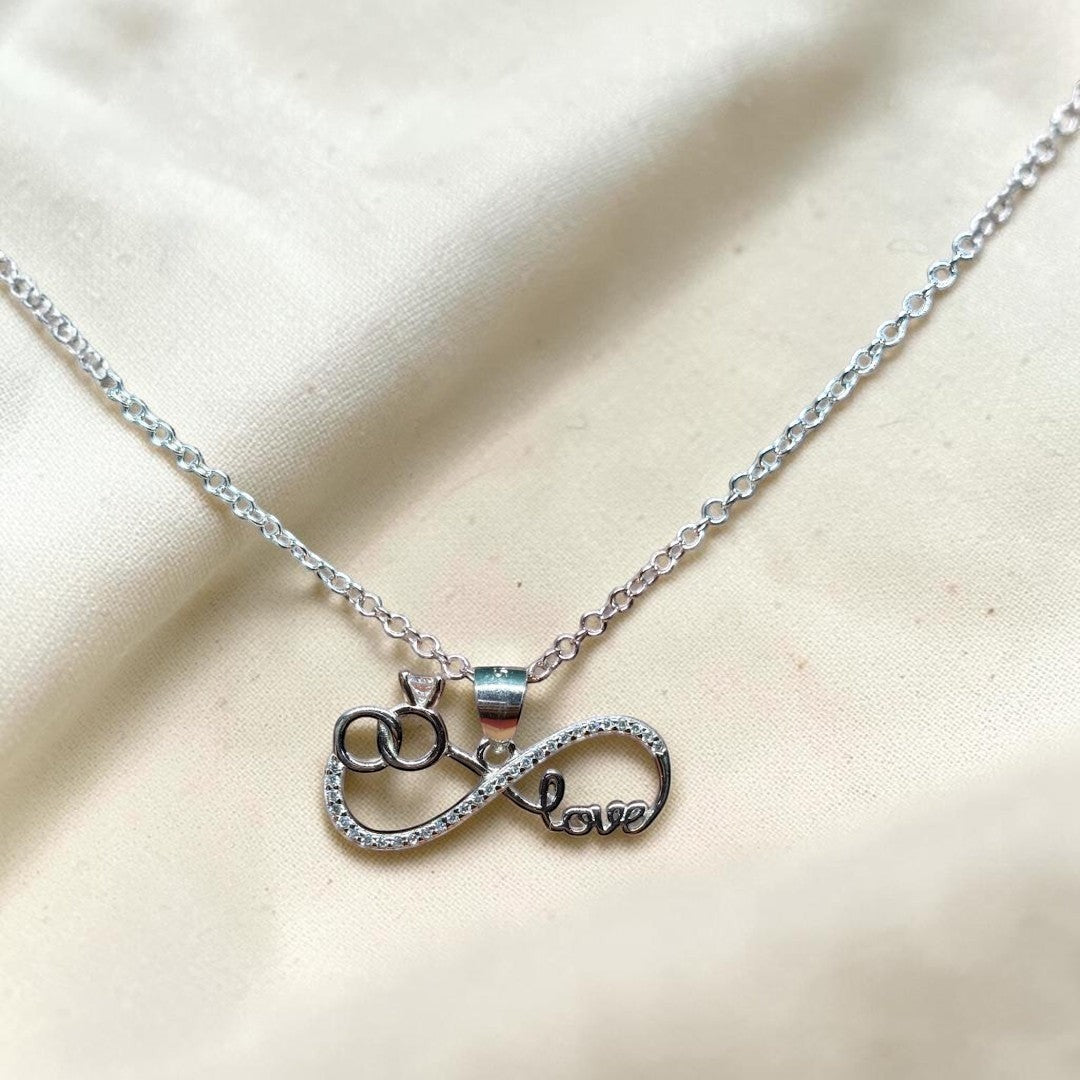 BlingbyAnvika silver infinity love pendant with cubic zirconia and interlocking rings.