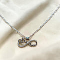BlingbyAnvika silver infinity love pendant with cubic zirconia and interlocking rings.