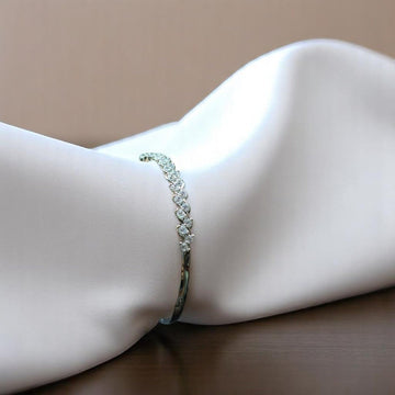BlingbyAnvika elegant 925 sterling silver kada bracelet with intricate leaf-like detailing and sparkling stones.