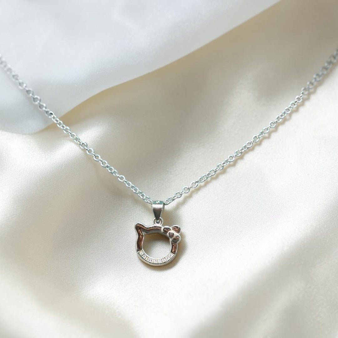 BlingbyAnvika 925 sterling silver pendant necklace with a cute open-worked kitty face, bow, and cubic zirconia accents.