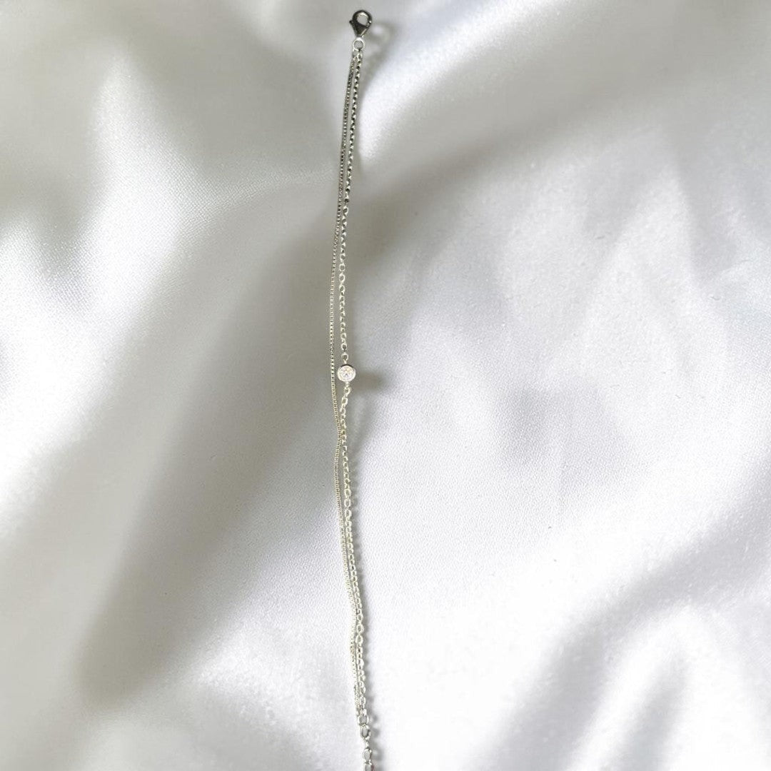 BlingbyAnvika 925 Sterling Silver layered chain bracelet with cubic zirconia accent and heart charm.