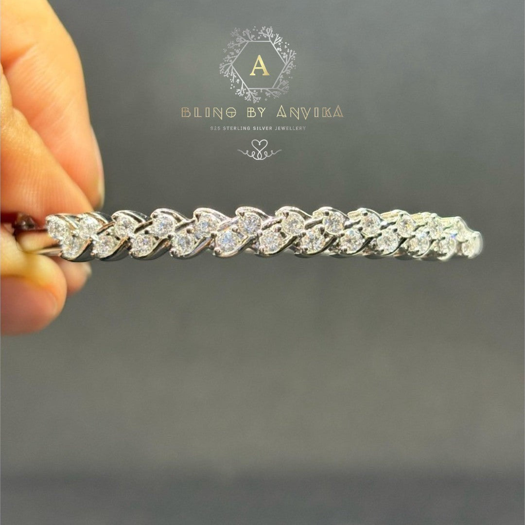BlingbyAnvika 925 sterling silver bracelet featuring an elegant leaf design with shimmering stones.