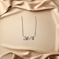 BlingbyAnvika 925 sterling silver necklace with 'LOVE' script and diamond accent.