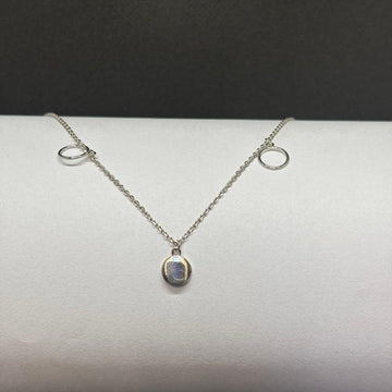 BlingbyAnvika sterling silver necklace with oval iridescent pendant and two circle accents. Minimalist design.