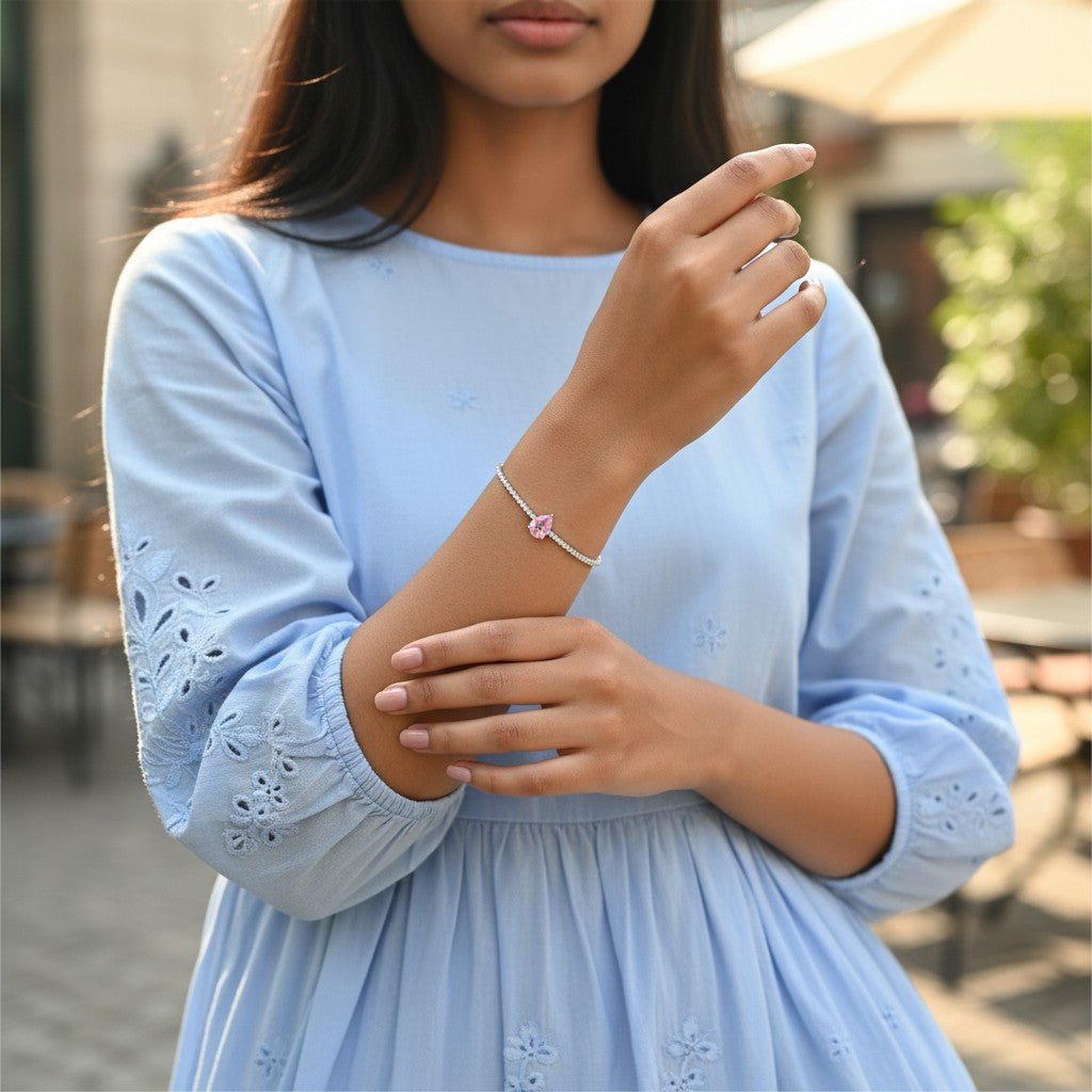 BlingbyAnvika 925 sterling silver bracelet with a delicate chain and a pear-shaped pink stone.