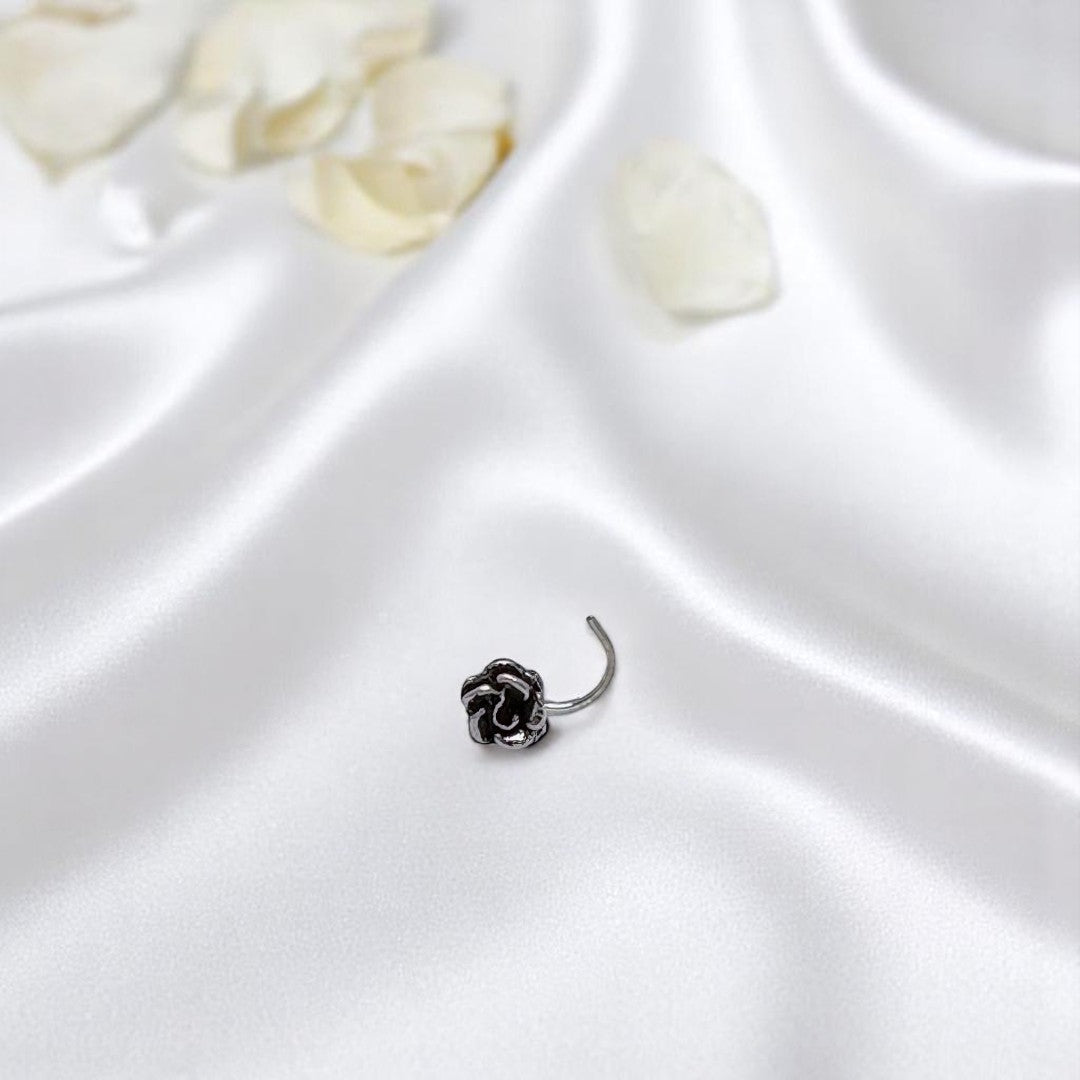 BlingbyAnvika 925 sterling silver nose pin featuring a detailed rose flower design on a white satin background