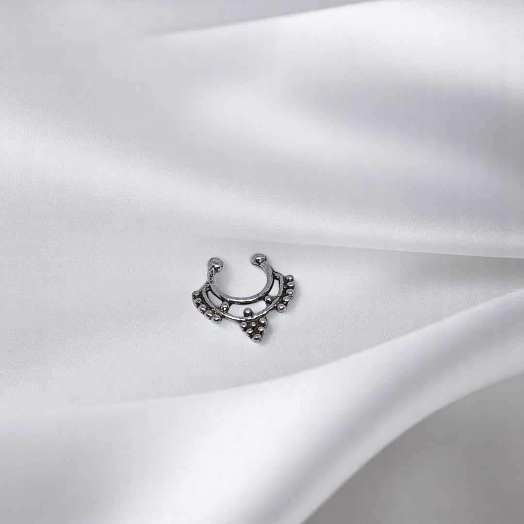 BlingbyAnvika 925 sterling silver septum ring with intricate beaded tribal design on a white satin background