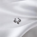 BlingbyAnvika 925 sterling silver septum ring with intricate beaded tribal design on a white satin background