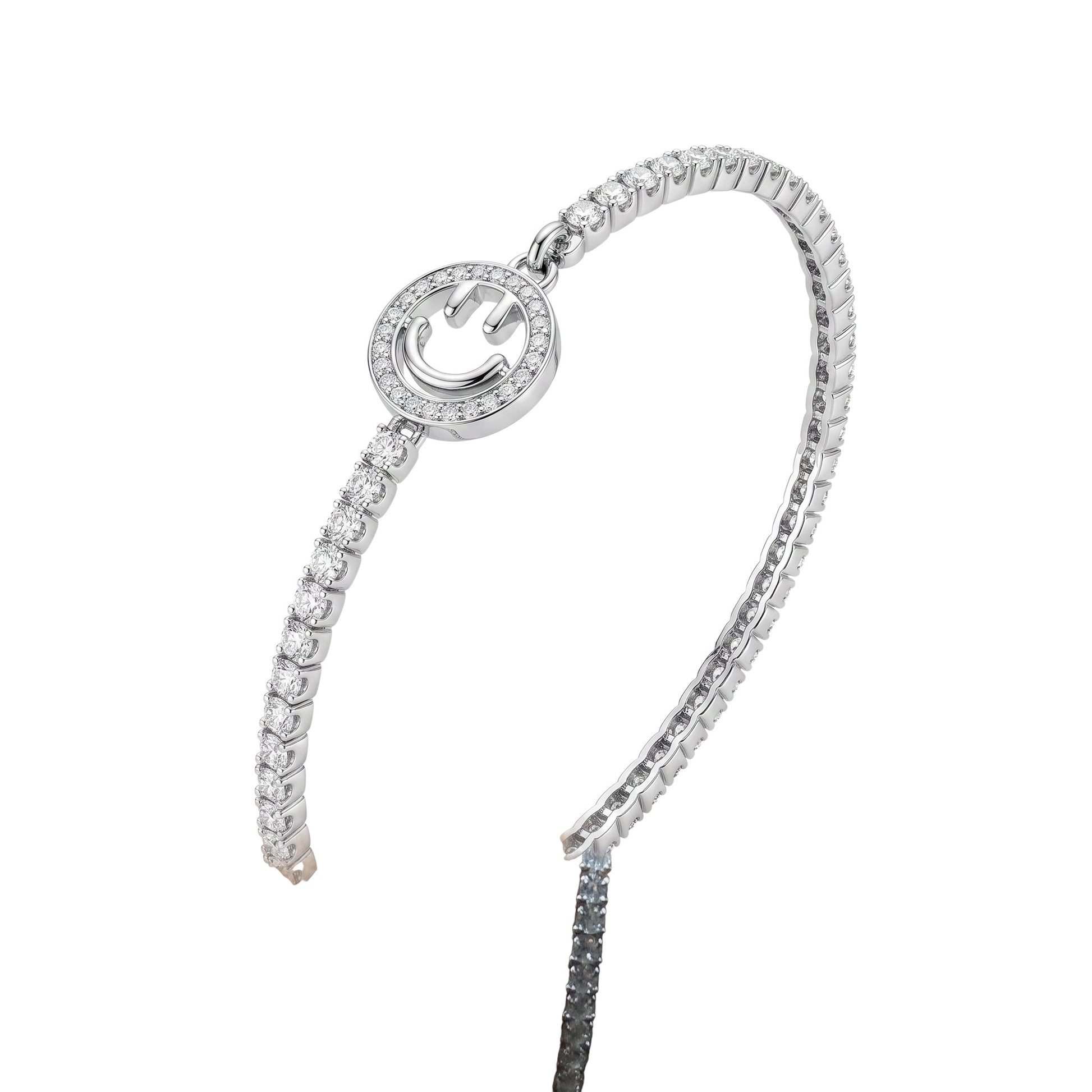 BlingbyAnvika 925 sterling silver tennis bracelet featuring a central smiley face charm with sparkling stones.