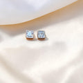 BlingbyAnvika 925 silver square-cut cubic zirconia stud earrings with clear stones.