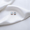 BlingbyAnvika 925 silver square-cut cubic zirconia stud earrings with clear stones and rose gold-tone setting.