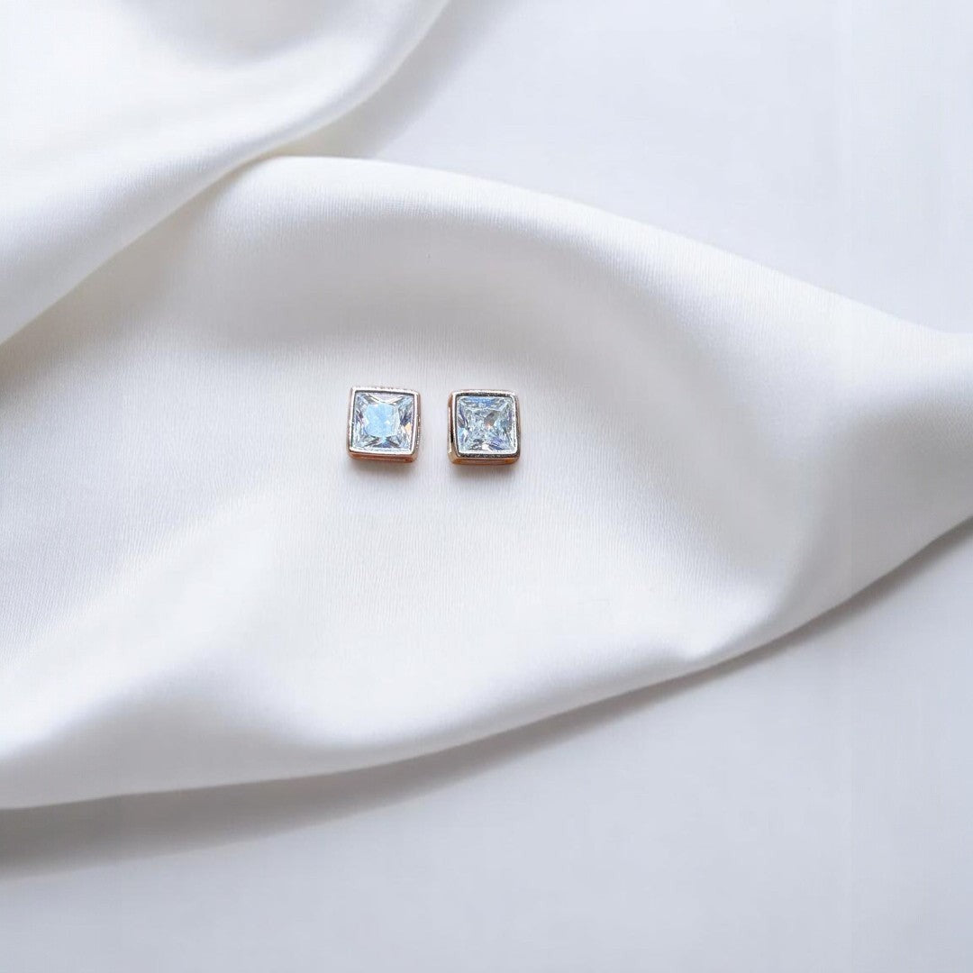 BlingbyAnvika 925 silver square-cut cubic zirconia stud earrings with clear stones and rose gold-tone setting.
