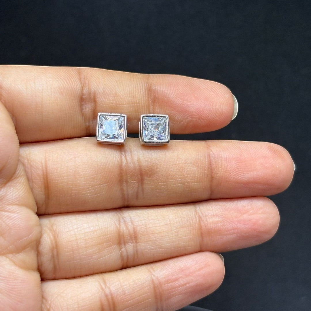 BlingbyAnvika 925 silver square-cut cubic zirconia stud earrings with clear stones.