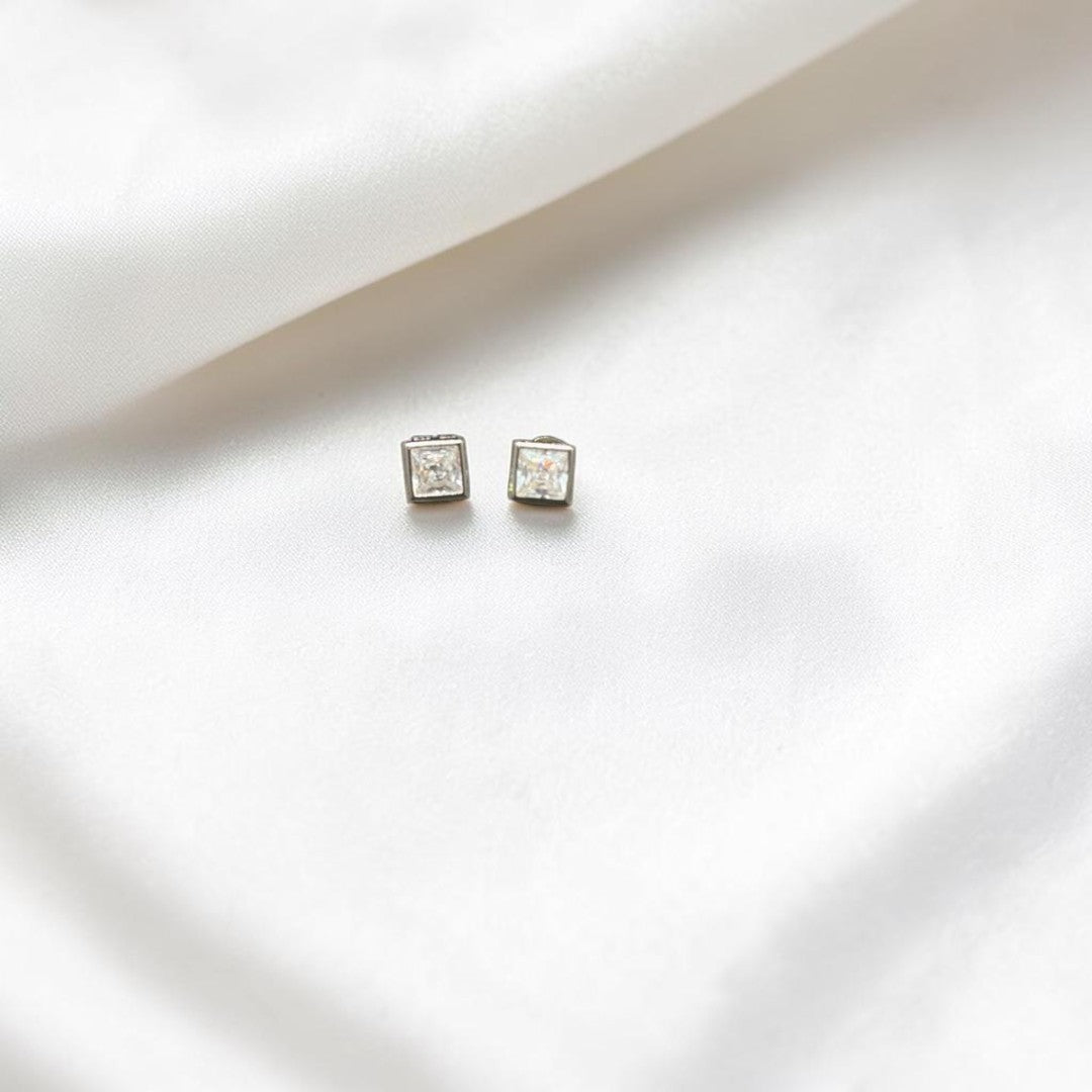 BlingbyAnvika 925 silver square stud earrings with clear cubic zirconia stones.