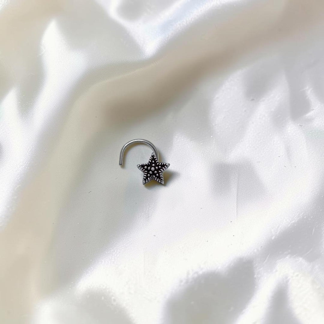 BlingbyAnvika 925 sterling silver nose pin featuring a delicate star design with a textured center