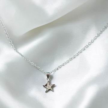 BlingbyAnvika sterling silver pendant with cubic zirconia star pendant.