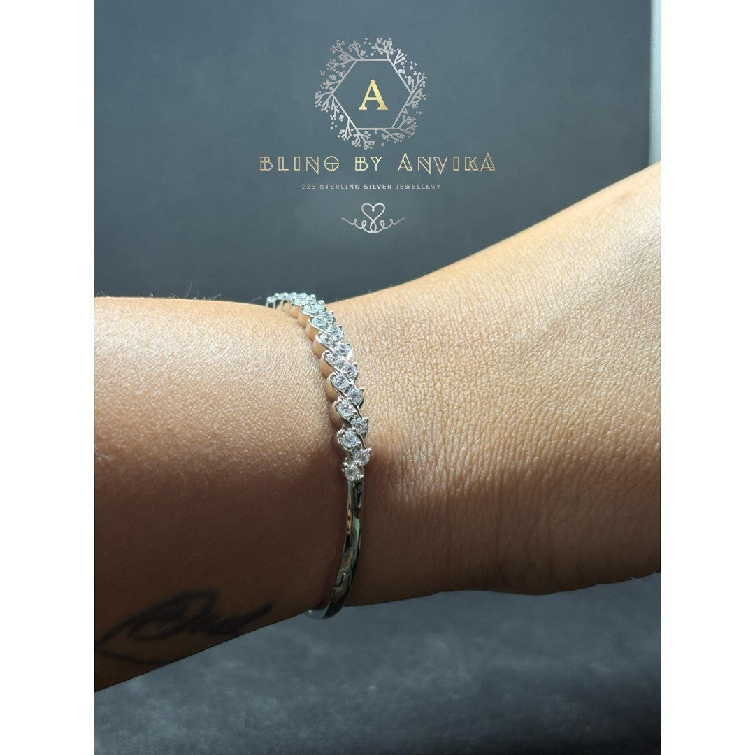 BlingbyAnvika 925 sterling silver link bracelet featuring brilliant-cut stones on a polished geometric frame on wrist