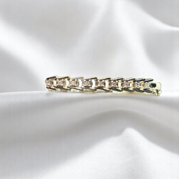 BlingbyAnvika 925 silver link bracelet featuring geometric settings with brilliant-cut stones on white satin fabric.