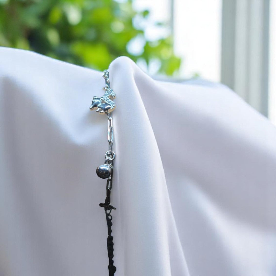 BlingbyAnvika silver-tone adjustable bracelet with a sparkling unicorn charm and dangling ball.