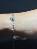 BlingbyAnvika silver-tone adjustable bracelet with a sparkling unicorn charm and dangling ball.
