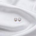 BlingbyAnvika 925 sterling silver heart-shaped stud earrings with AAA-grade zircon stones, hypoallergenic and nickel-free.