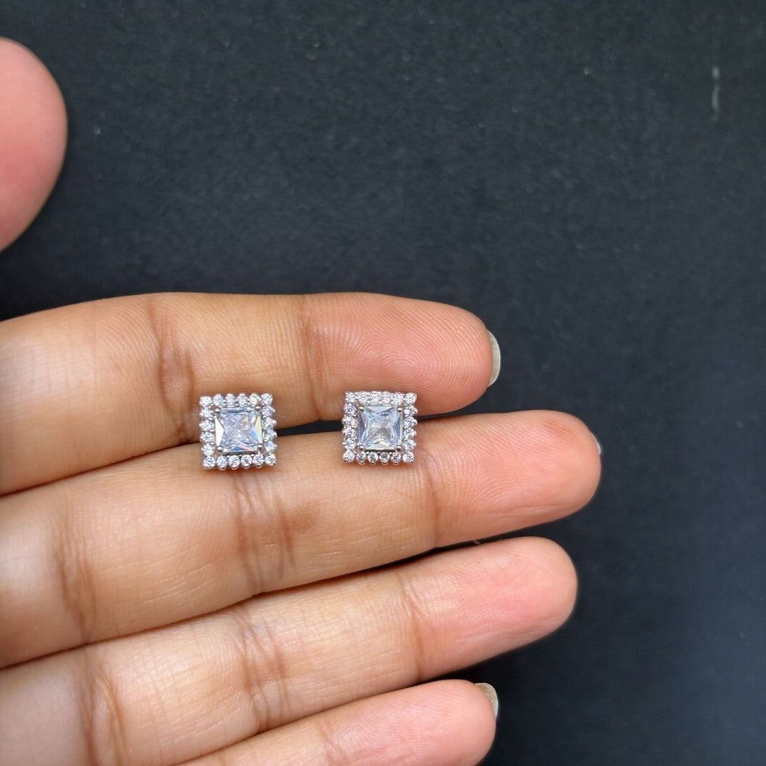 BlingbyAnvika 925 sterling silver square stud earrings with clear AAA-grade zircon stones and a halo of smaller stones.
