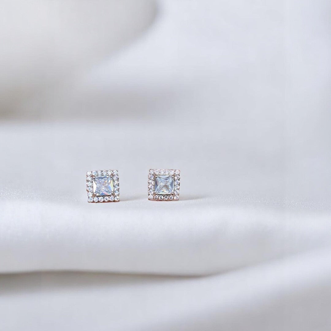 BlingbyAnvika 925 sterling silver square stud earrings with clear AAA-grade zircon stones and a halo of smaller stones.