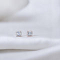 BlingbyAnvika 925 sterling silver square stud earrings with clear AAA-grade zircon stones and a halo of smaller stones.