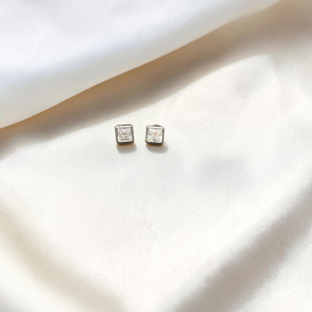 BlingbyAnvika square-cut cubic zirconia stud earrings in polished metal. Minimalist design with brilliant sparkle.