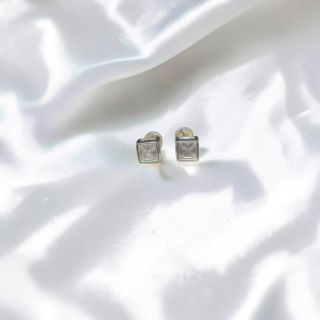 BlingbyAnvika square stud earrings featuring AAA-grade zircon stones set in 92.5 sterling silver on white fabric.