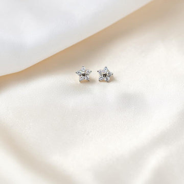 BlingbyAnvika sterling silver star stud earrings with cubic zirconia stones.