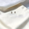 BlingbyAnvika sterling silver stud earrings with cubic zirconia and screw backs.