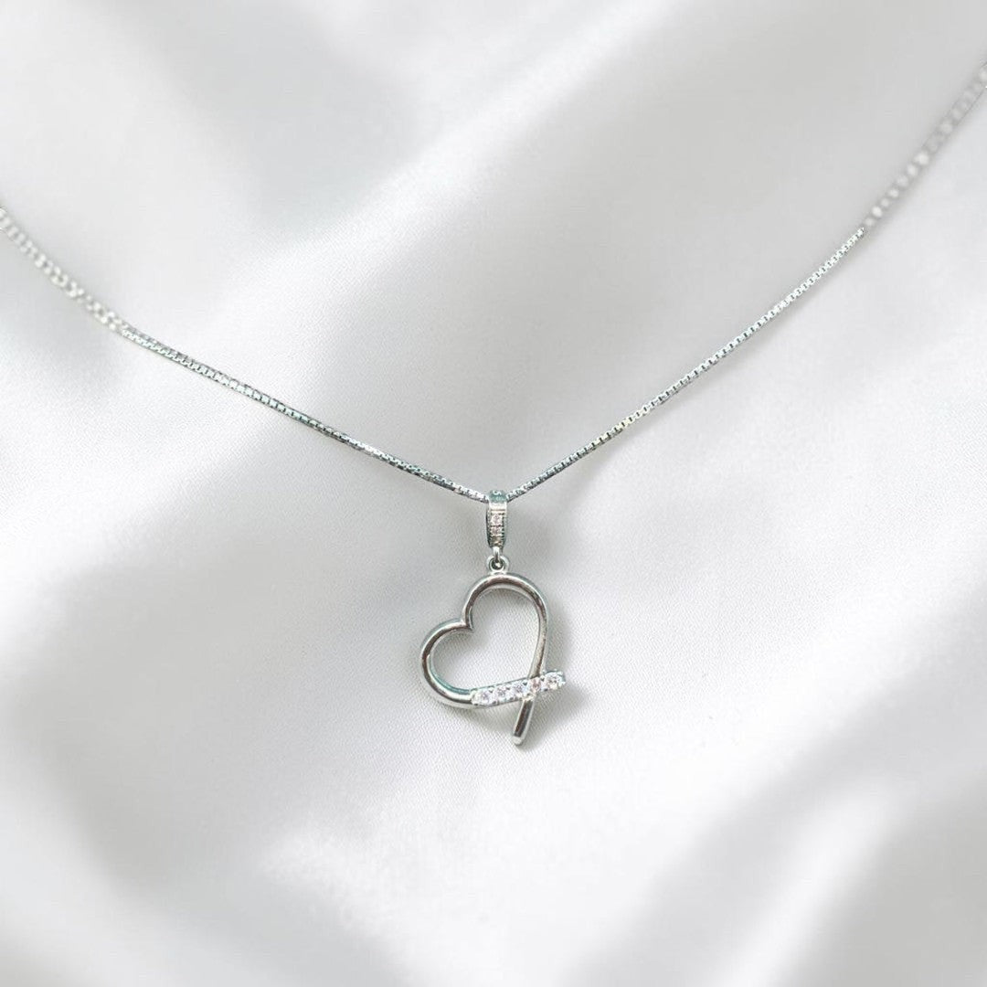 BlingbyAnvika sterling silver heart pendant necklace with cubic zirconia accent stones on a delicate chain.