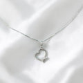 BlingbyAnvika sterling silver heart pendant necklace with cubic zirconia accent stones on a delicate chain.