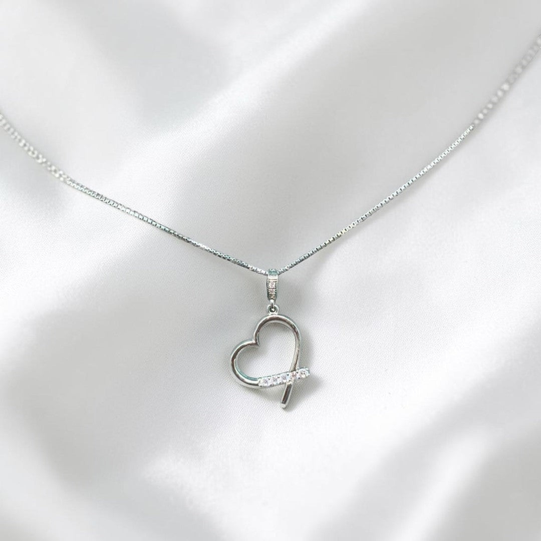 BlingbyAnvika sterling silver heart pendant necklace with cubic zirconia accent stones on a delicate chain.