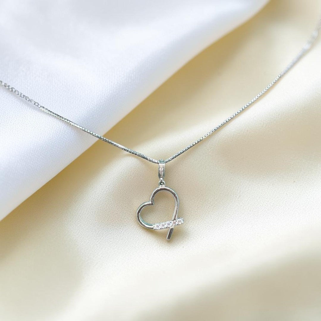 BlingbyAnvika sterling silver open heart pendant necklace with cubic zirconia accent stones on a delicate chain.