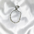 BlingbyAnvika sterling silver bolo bracelet with infinity symbols and cubic zirconia. Adjustable clasp.