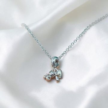 BlingbyAnvika sterling silver teddy bear charm necklace with delicate chain and textured paws.