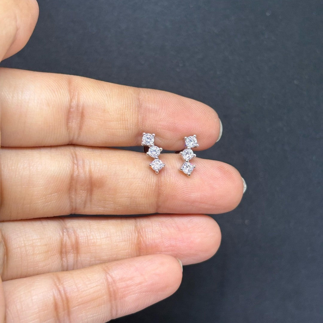 BlingbyAnvika sterling silver stud earrings featuring three sparkling AAA-grade zircon stones in a vertical design.