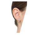 BlingbyAnvika sterling silver stud earrings featuring three sparkling AAA-grade zircon stones worn on an earlobe.
